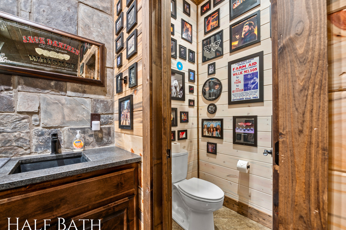 This stylish half bath combines rustic wood accents with modern charm, offering convenience with a cozy feel.