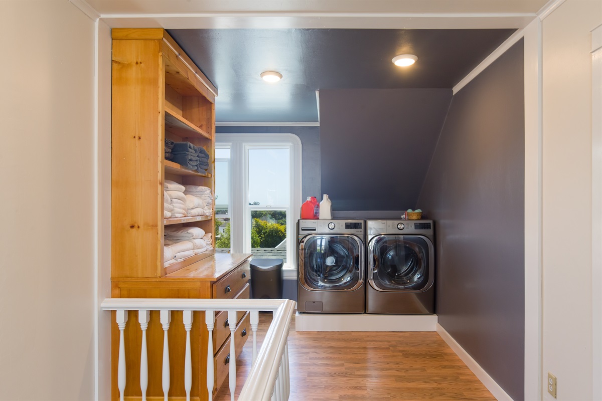 Upstairs laundry room with washer and dryer