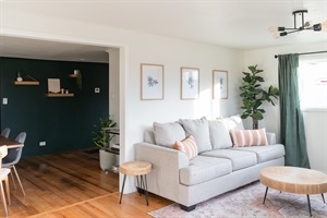 Adding a touch of warmth and coziness to our home with our carefully curated wall decor and lush plants