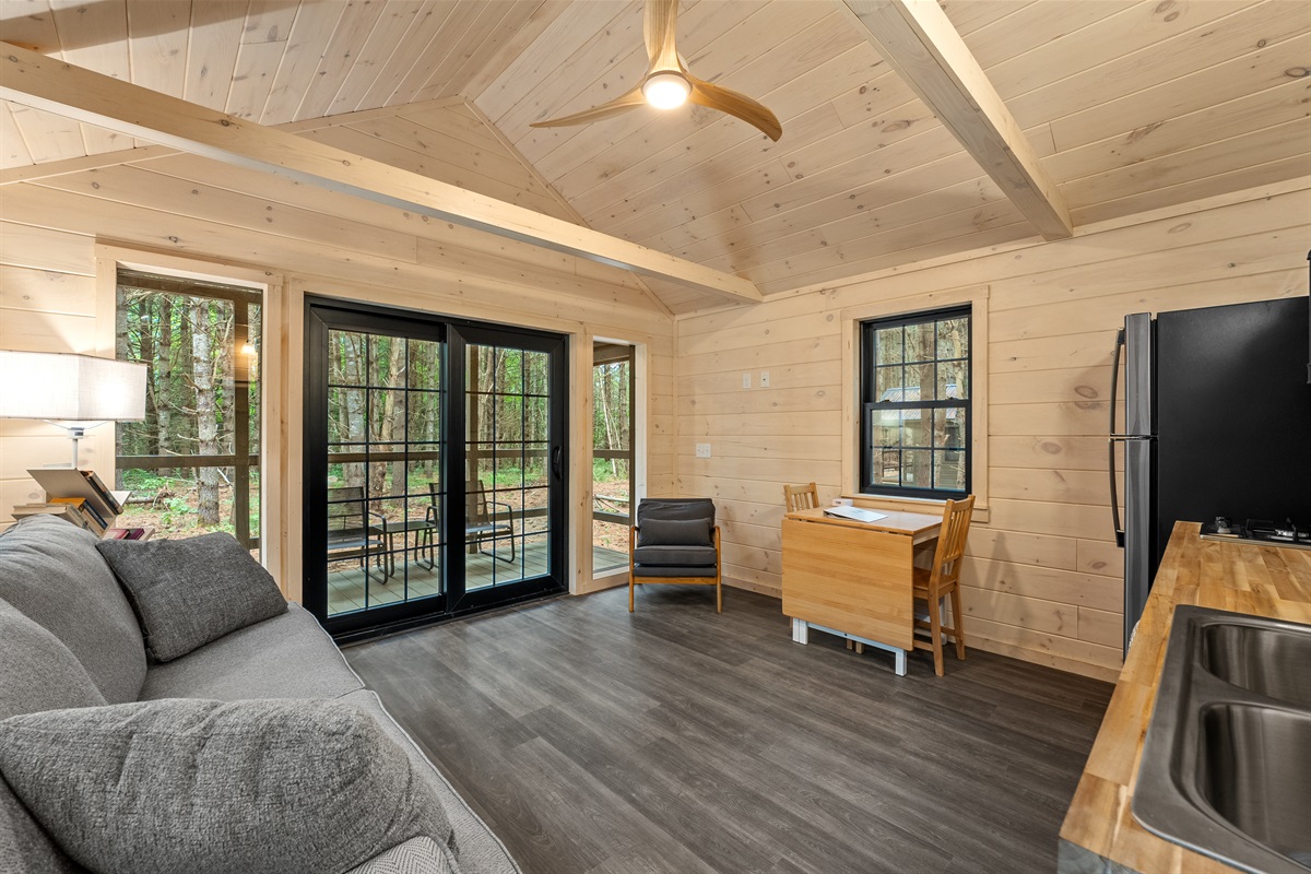 Living room, ceiling fan, open to private porch