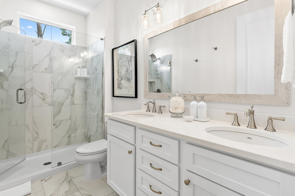 Refresh and unwind in the spacious primary bath featuring a walk-in shower and double sinks. For added convenience, we provide a hair dryer, shampoo, conditioner, body wash, and hand soap—so you can pack a little lighter!
