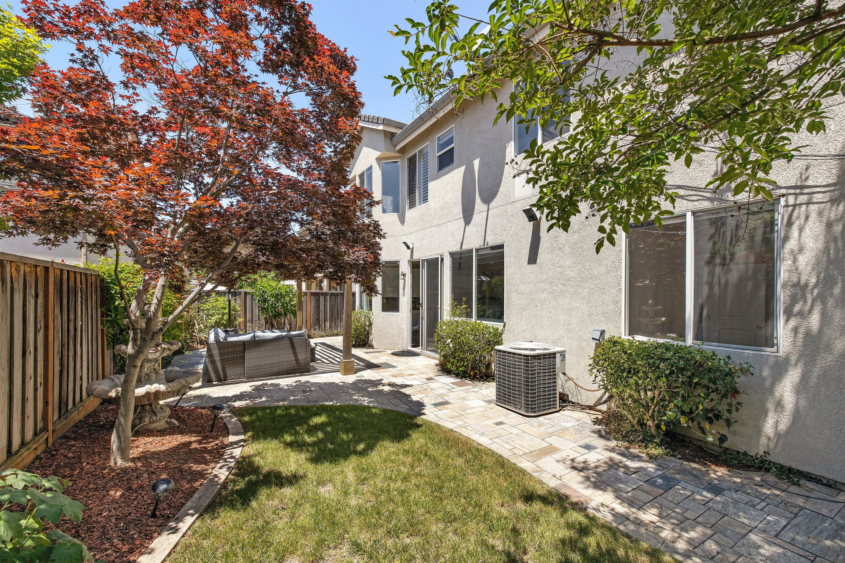 Enjoy the day or night in our spacious backyard