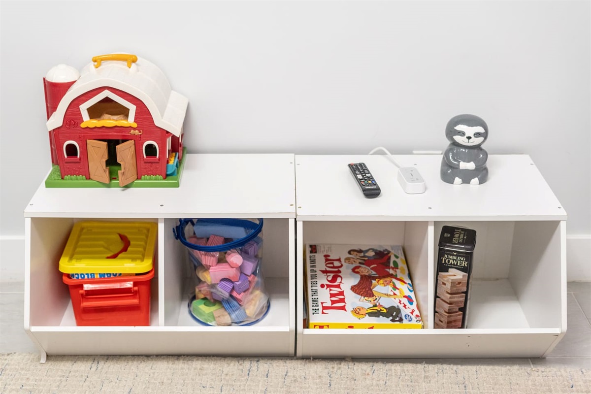Organized cubbies with blocks, books, and games ready for play.

