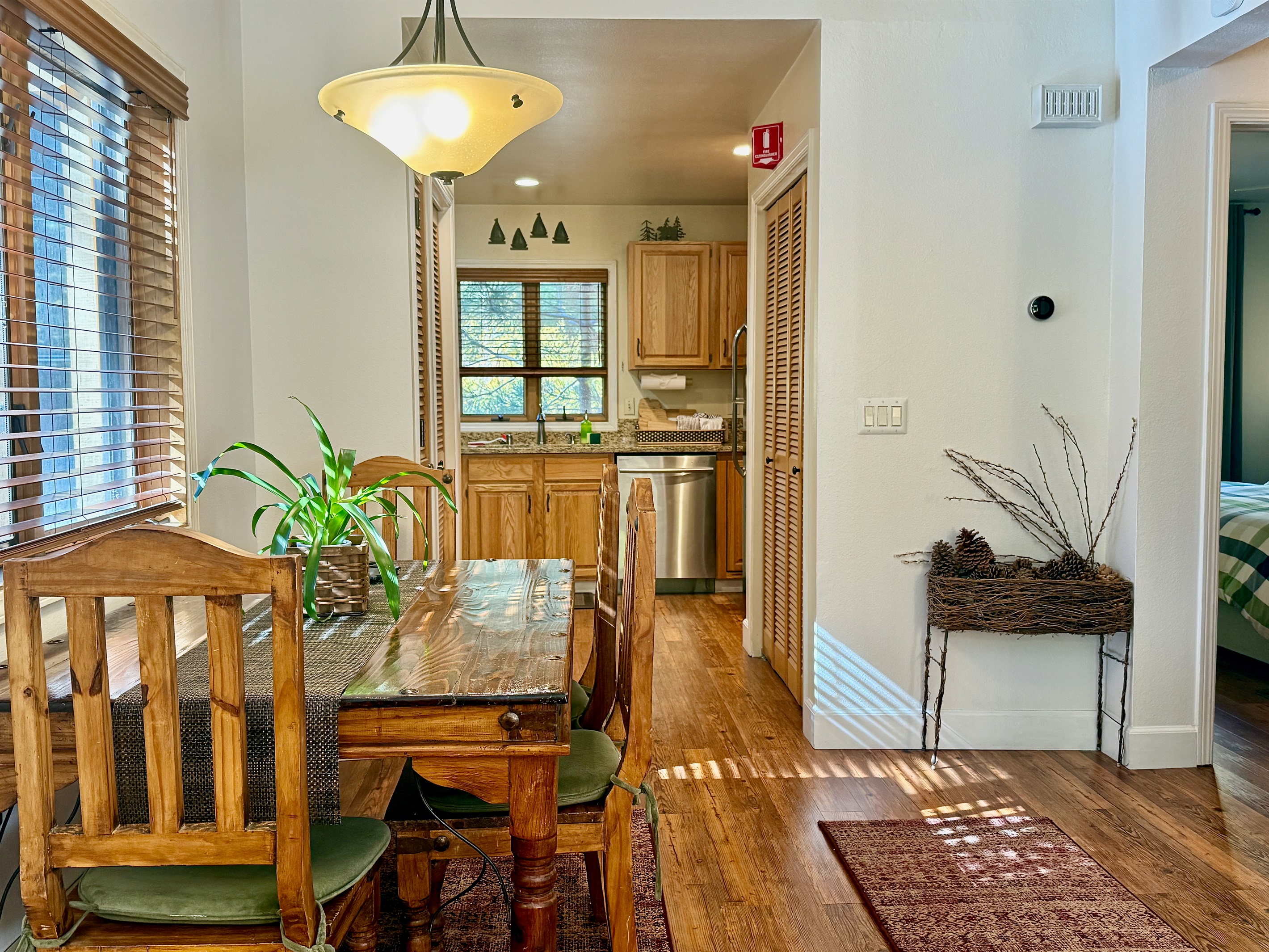 Layout flows seamlessly from the living room through the dining area to kitchen