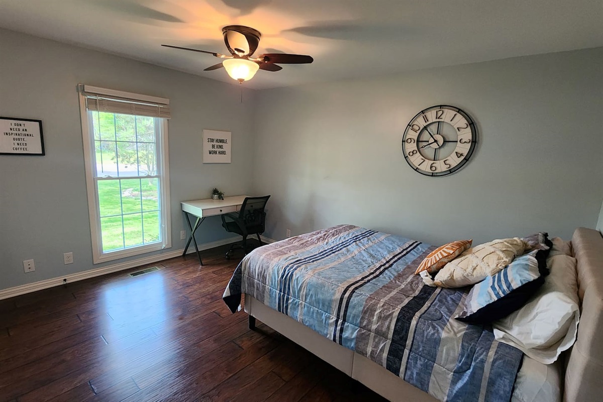 Queen bed with workspace. 