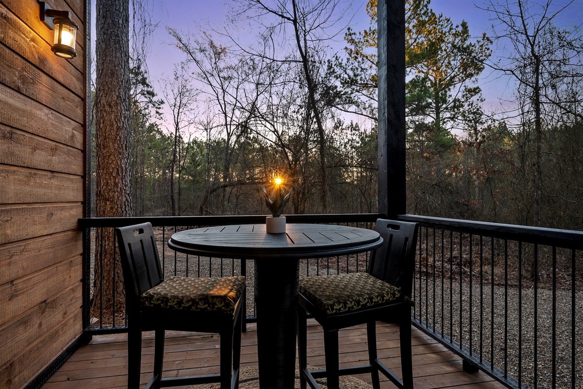 A cozy table for two makes it perfect for morning coffee or evening wine.