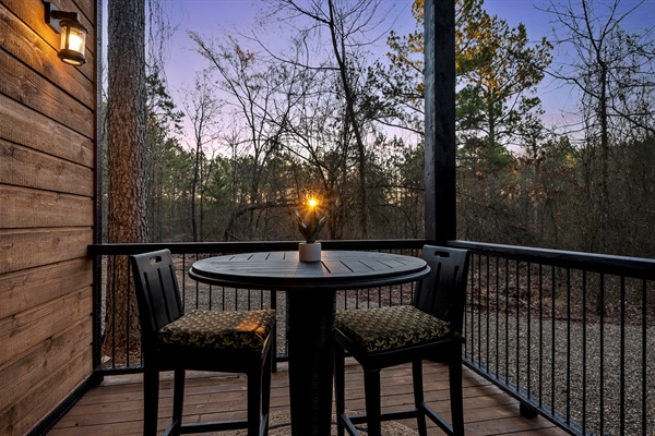 A cozy table for two makes it perfect for morning coffee or evening wine.