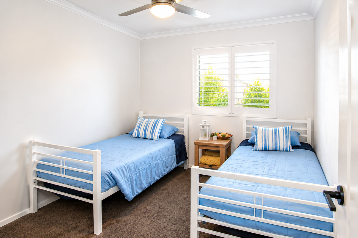 Twin single bedroom on the first floor, adding flexible bedding to Sant’s Beach Retreat alongside queen and double bedrooms.