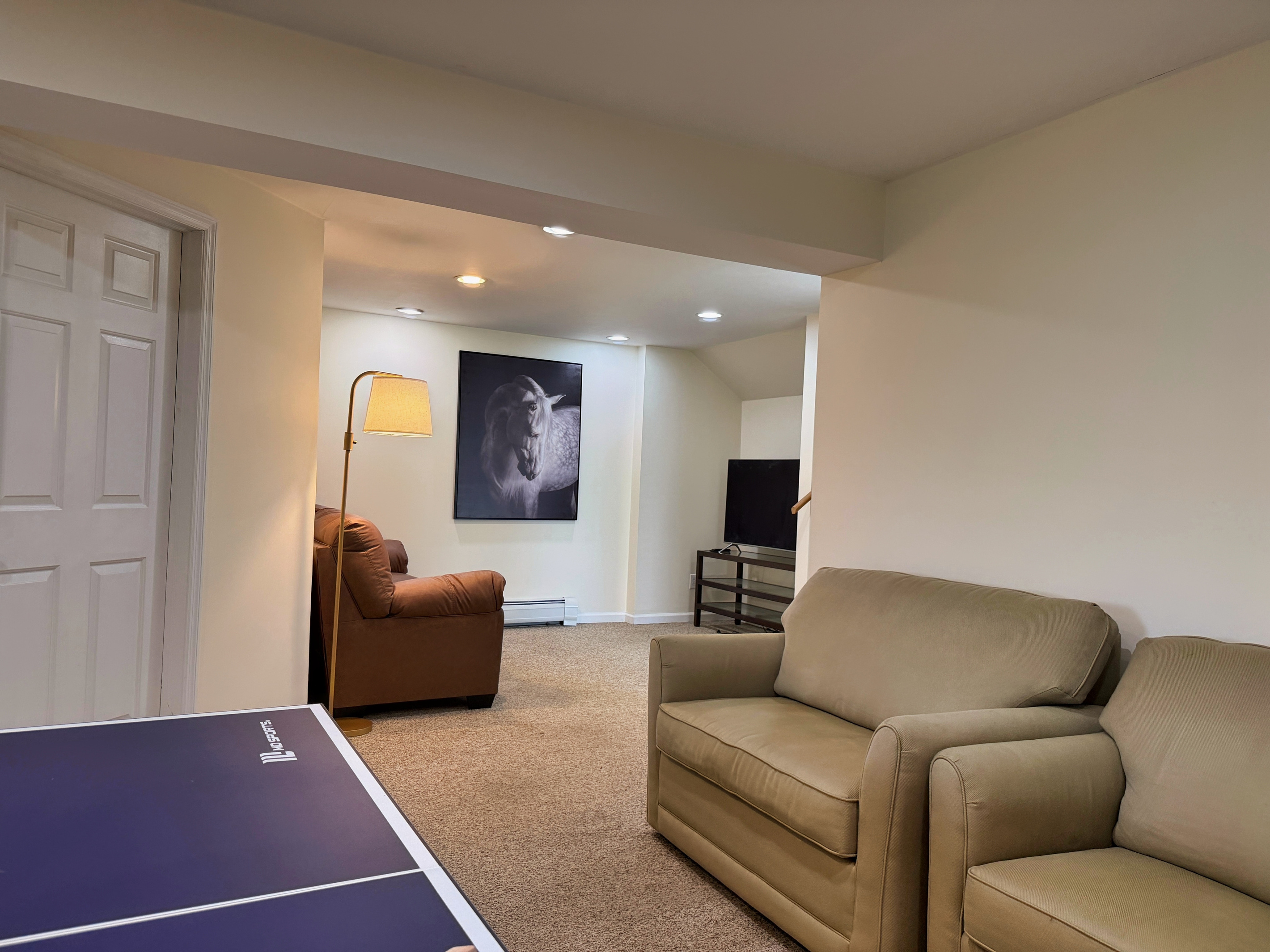 Ground floor game room with ping pong and  a Smart TV