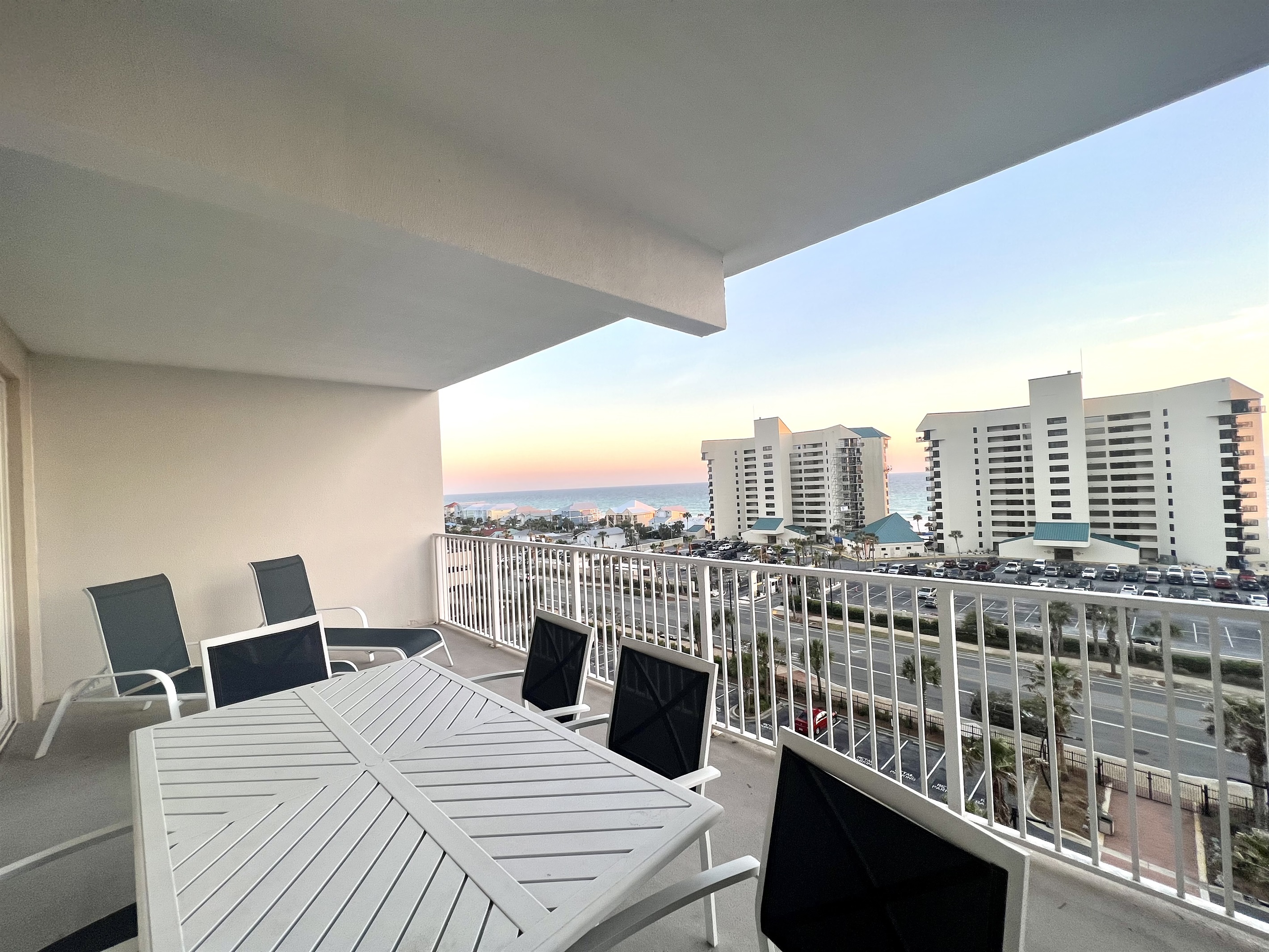 Balcony has 2 loungers, table with 6 chairs