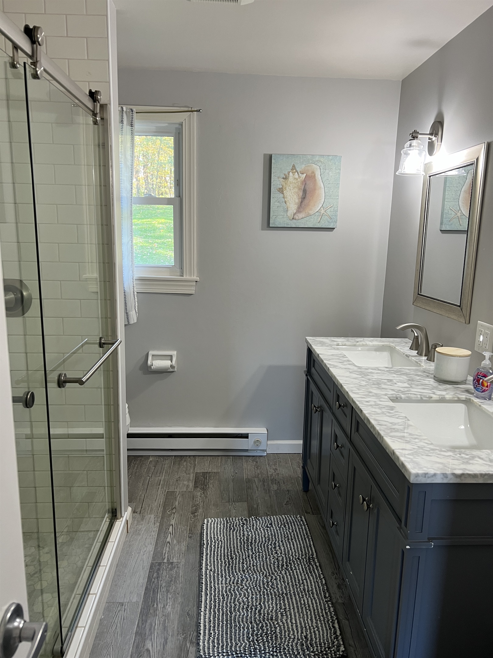 Hilltop Hideaway 1st floor full bathroom in the hallway.