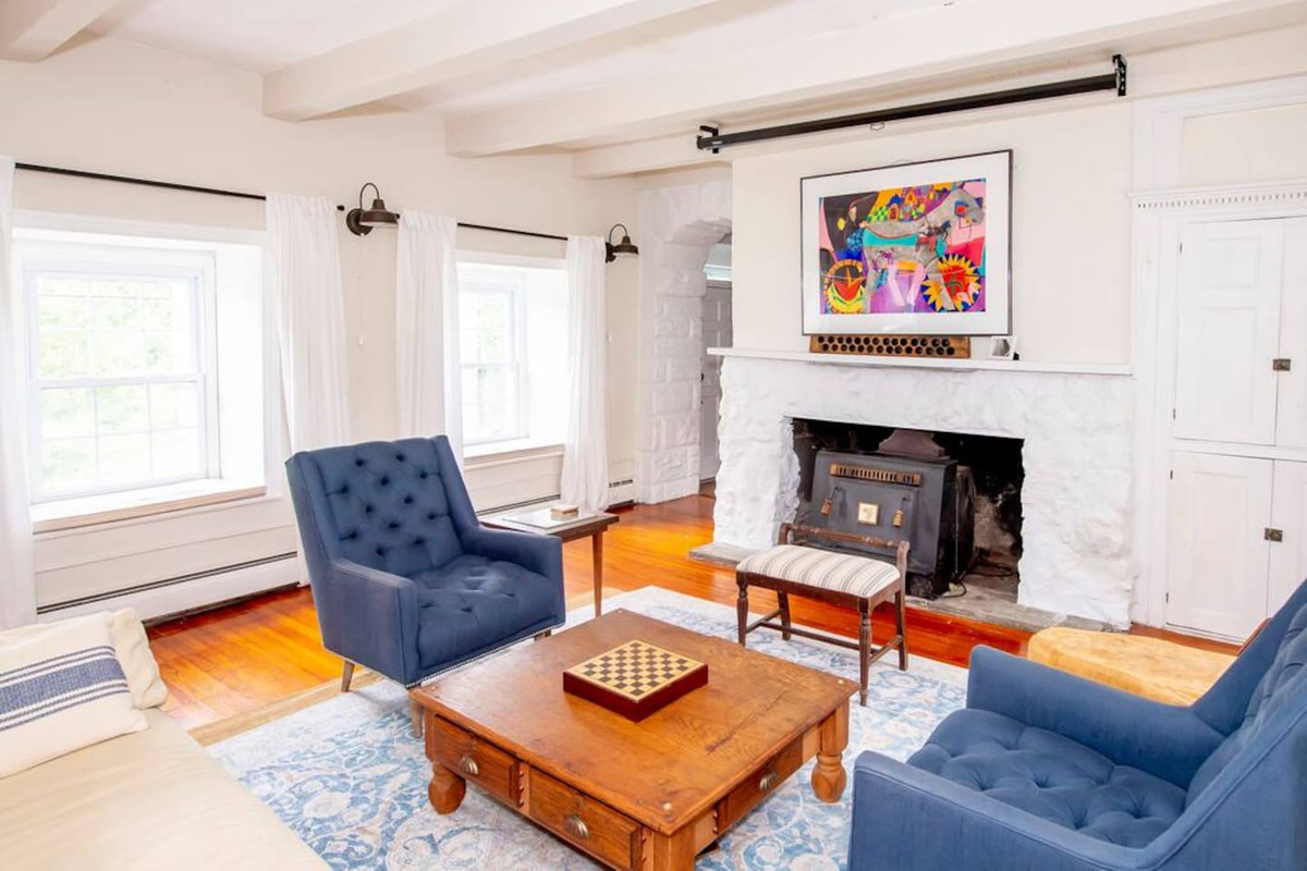 Living room with original stone fireplace