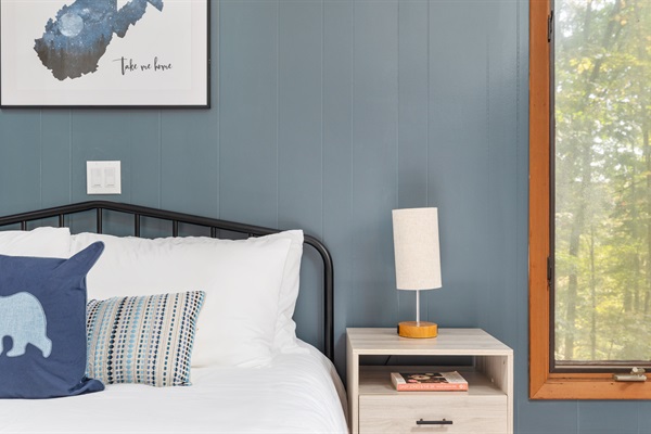 Relax and recharge in this spacious Queen bedroom, with added blankets, pillows, and fitness gear to start your day right.