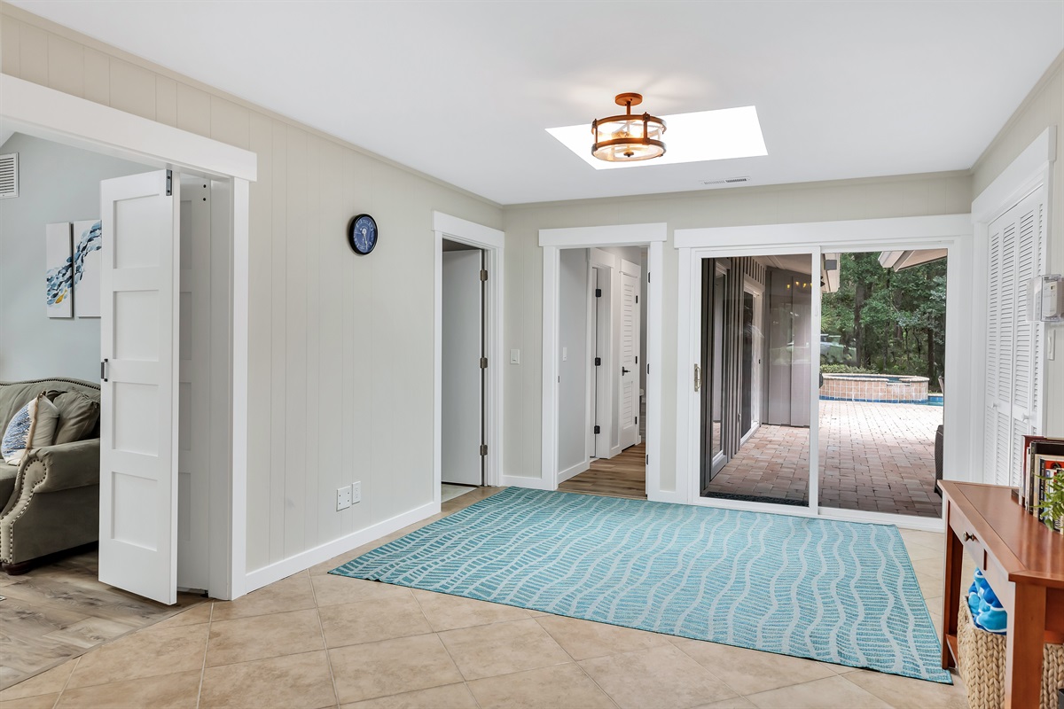 Foyer leads out to the pool and large deck