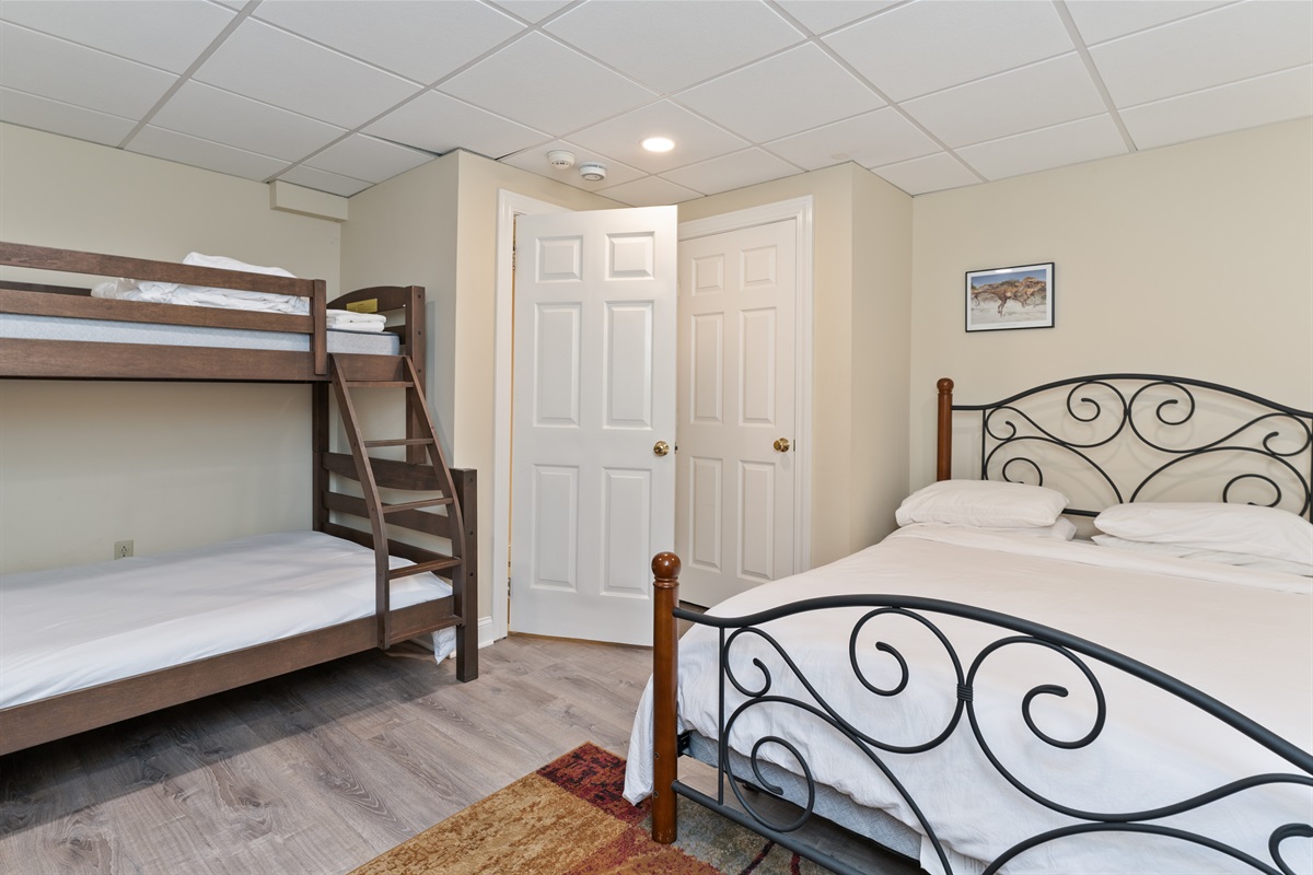 Lower level Queen bedroom with bunk beds(full on the bottom/twin on top)
