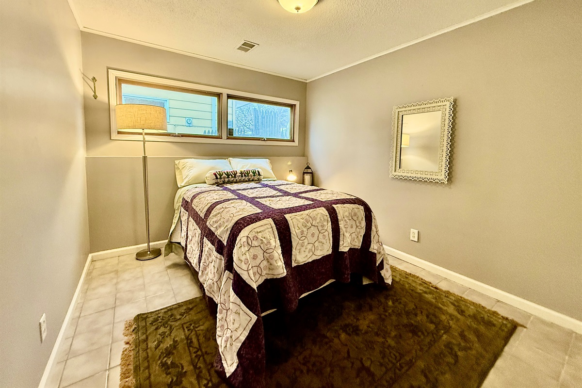 Bedroom 4, perfect kids bedroom located off the basement living room. Comfy plush double bed in a warm, quiet room makes for a perfect spot to catch some Zzz's.