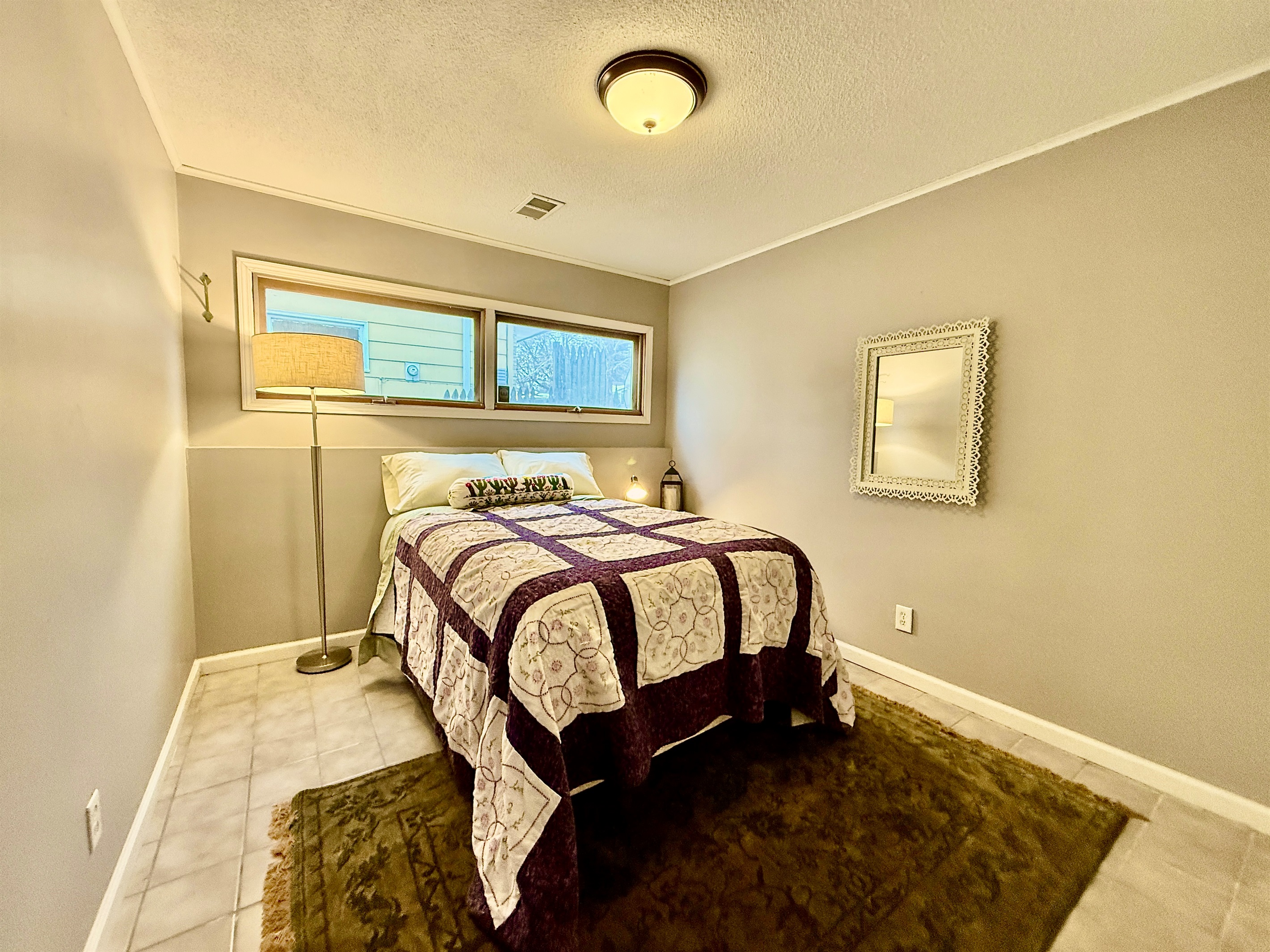 Bedroom 4, perfect kids bedroom located off the basement living room. Comfy plush double bed in a warm, quiet room makes for a perfect spot to catch some Zzz's.