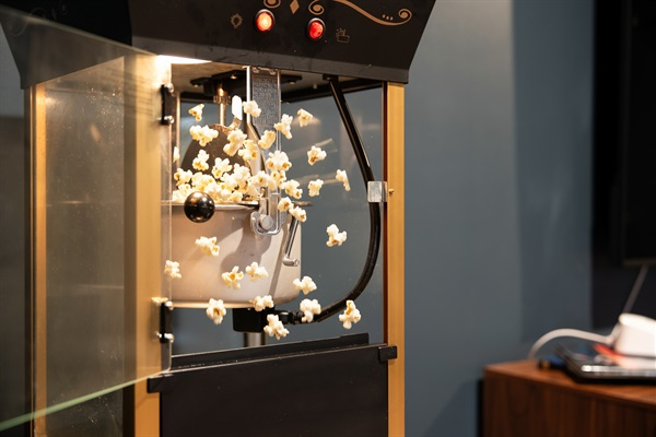 A retro-style popcorn machine completes the movie night vibe—just add your favorite film.