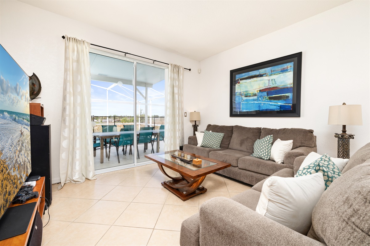 The door from the theater room opens to the covered lanai.
