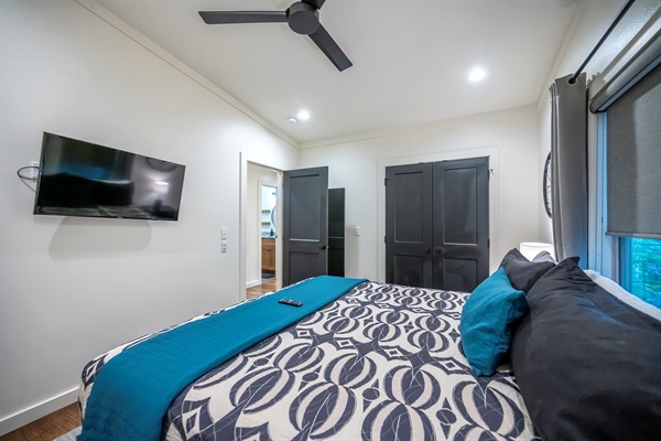 Upstairs king bedroom with a cozy workspace — perfect for relaxing or catching up on a little work between adventures. 💻🛏️