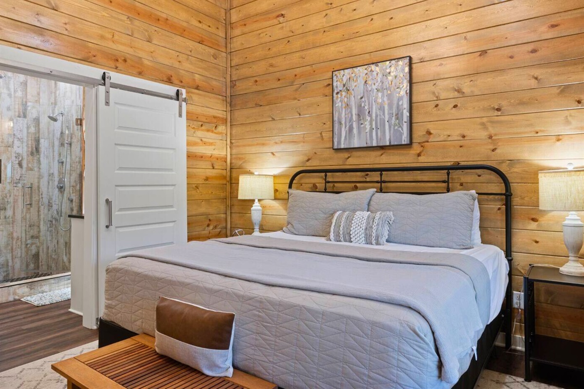 This king bedroom is a soft lullaby, inviting rest and rejuvenation