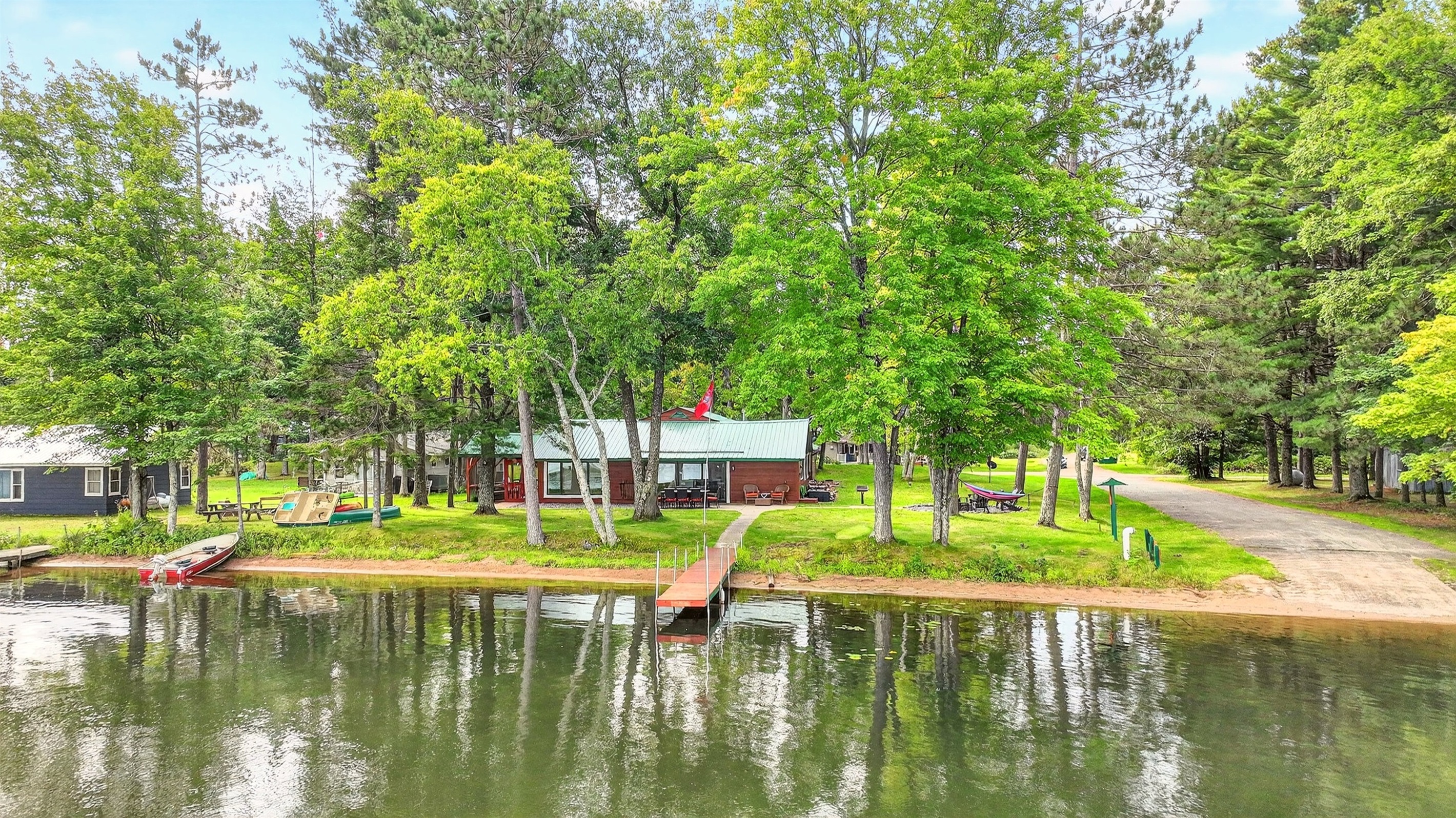 The home has a large, park-like yard situated directly next to the public boat launch for easy access. The home has a private dock for fishing or docking your boat.