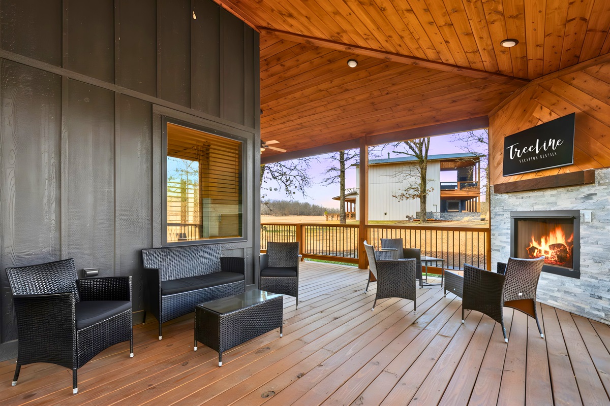 Warm lighting and cozy seating make this covered patio feel like an outdoor living room you&rsquo;ll want to use every day.