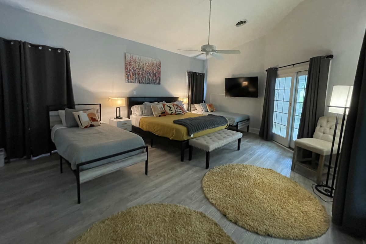 Master bedroom with 1 king bed and 2 twin beds