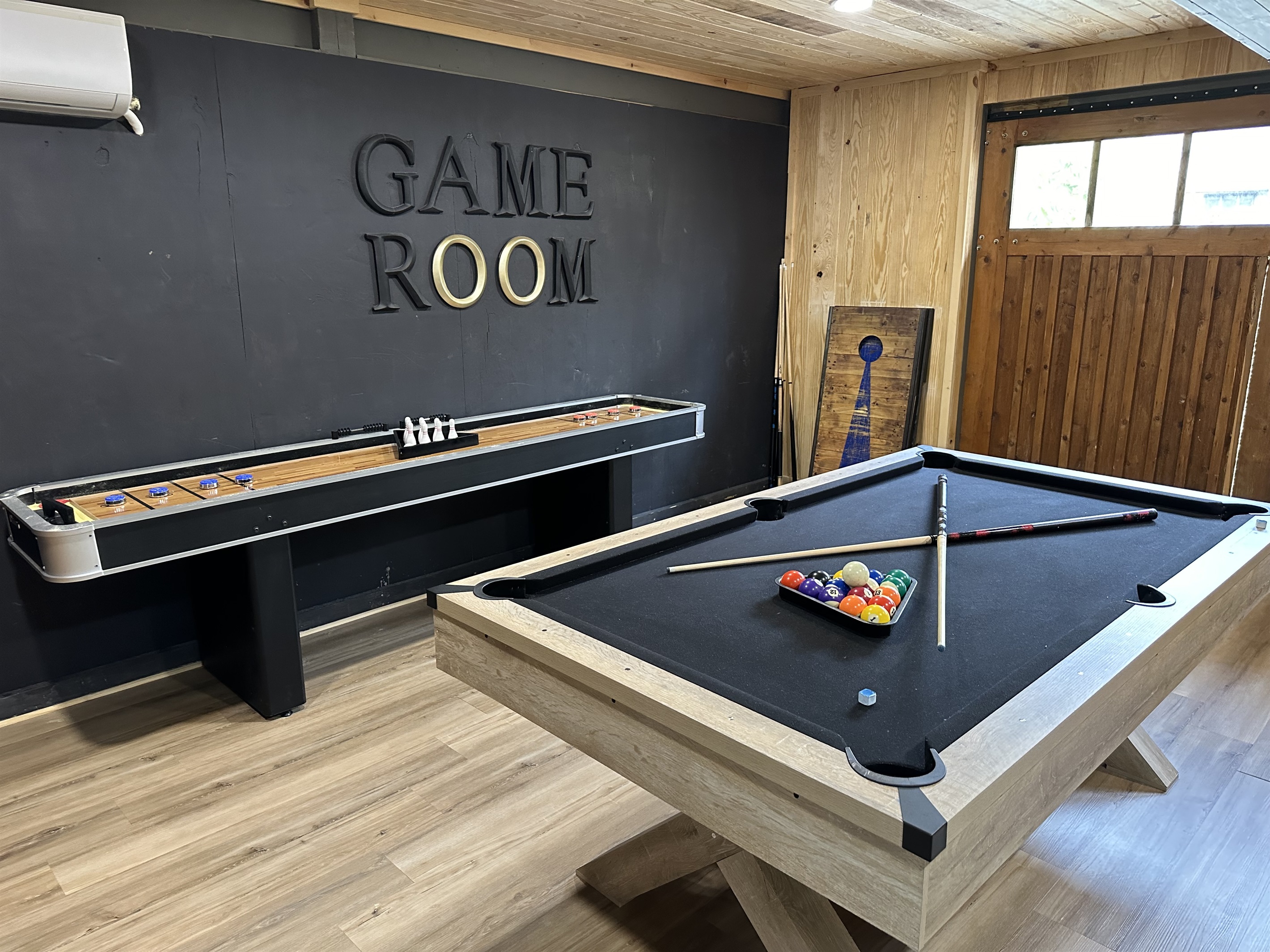 GAME ROOM! This game room has a Pool Table, Shuffleboard, Dart Board, Arcade!!