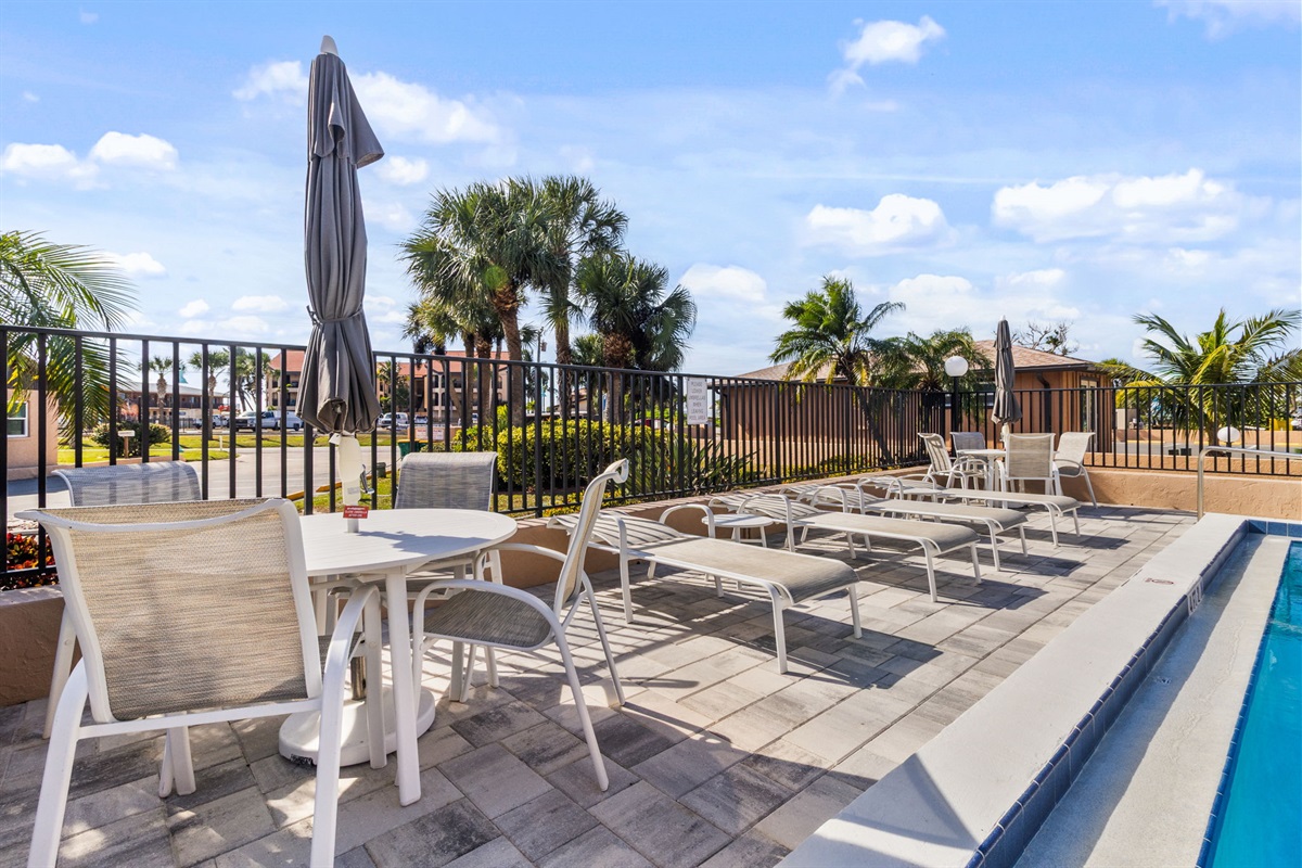 Heated pool is just steps away from the unit.