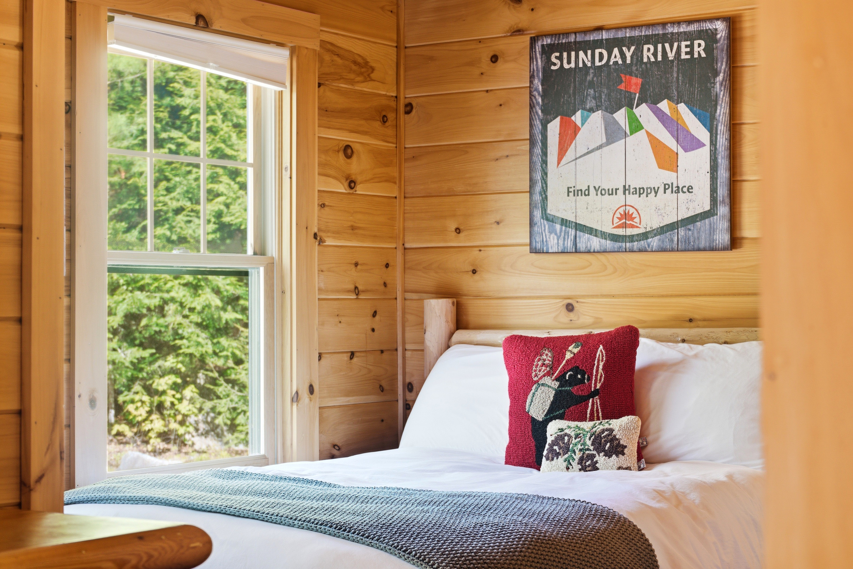 Bright and welcoming sleeping space with woodland views just outside the window.
