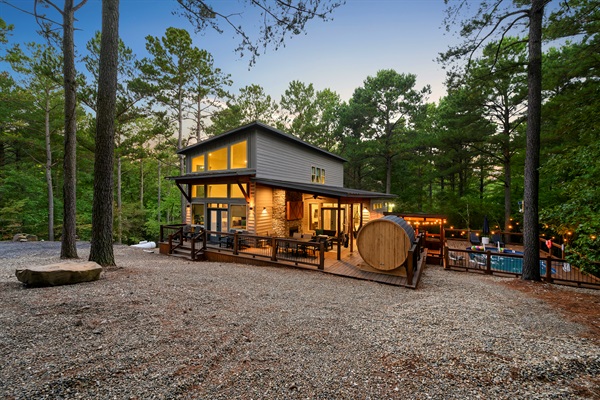 Soak, swim, or steam — your private spa-inspired backyard has it all, from the bubbling hot tub to the glowing pool and cedar barrel sauna.