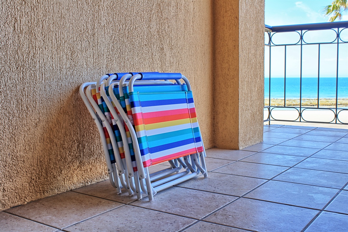 balcony with sand chairs (there use 2-4 chairs usually available)