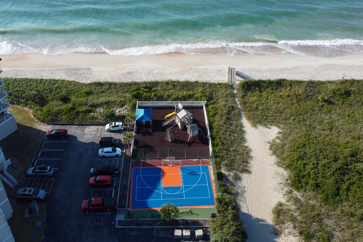 St. Regis outdoor area features a playground, basketball court, and easy beach access