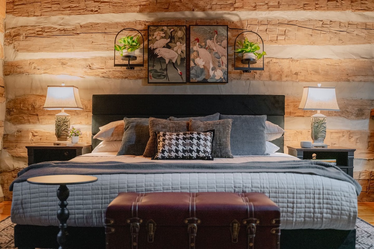 A loft bedroom with a plush king bed and memory foam mattress for comfort.