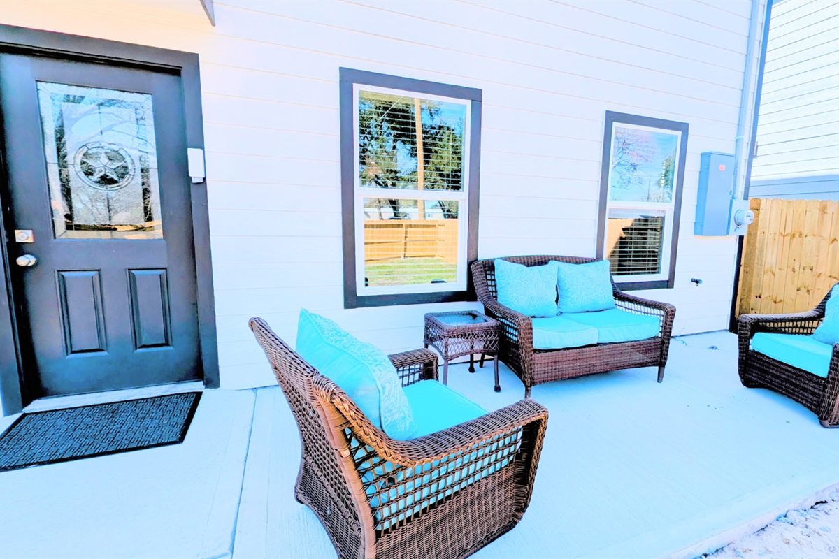 Relax on the spacious back patio with fully fenced yard.