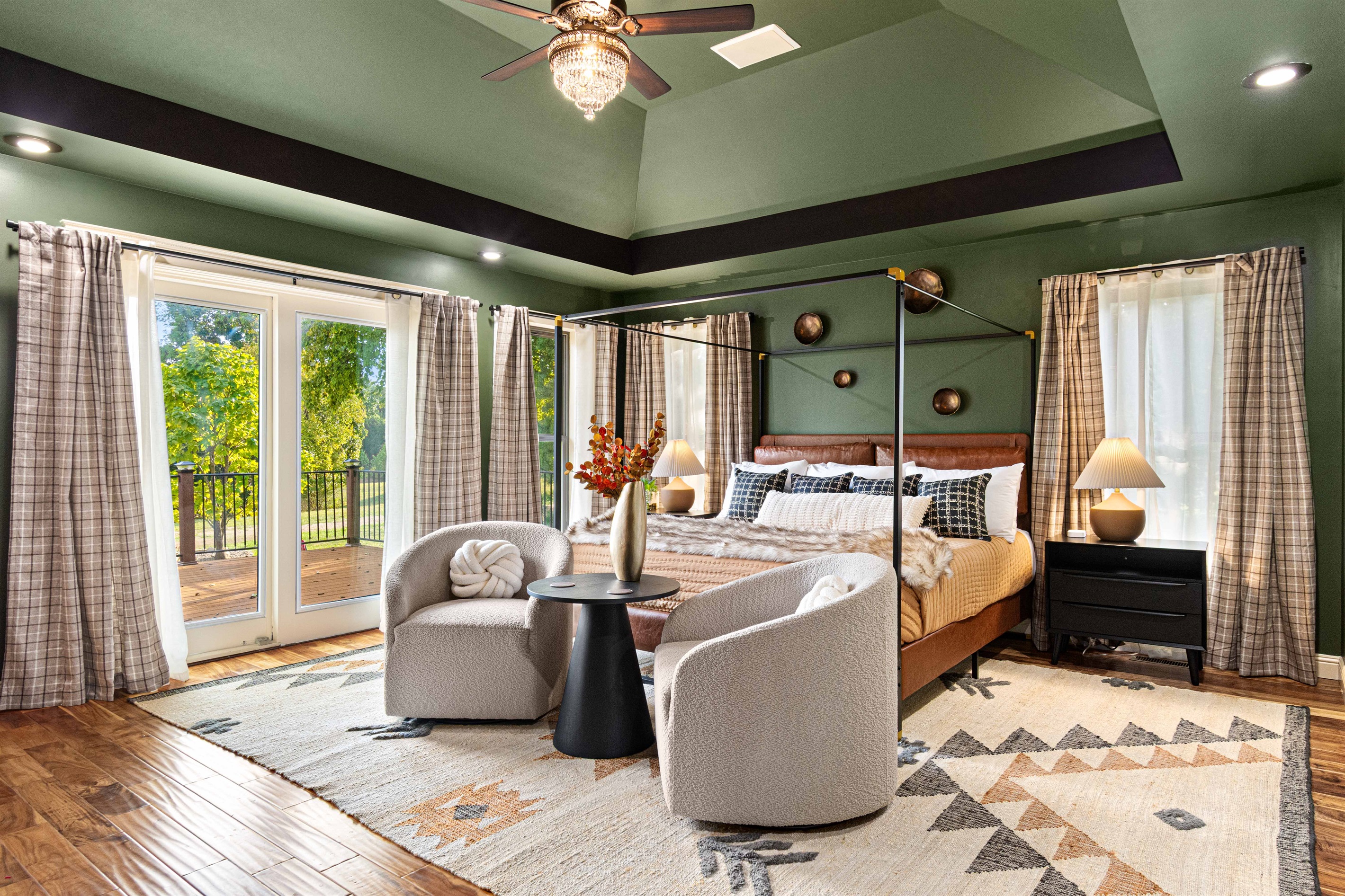 Primary bedroom on main level (bedroom #3) with private ensuite bathroom and walk out deck