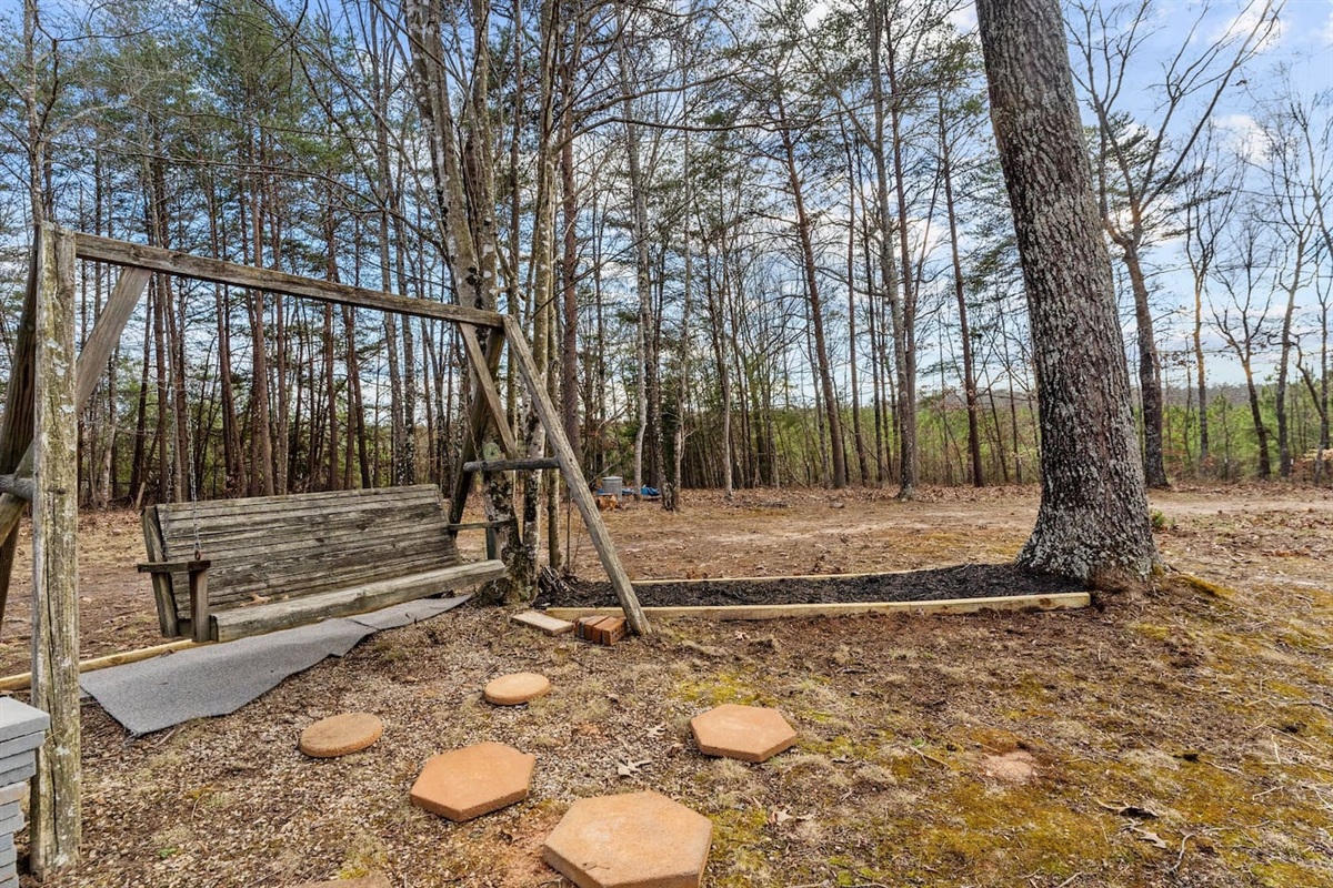 Outdoor Retreat: Swing into serenity on this charming swing amid nature's splendor!