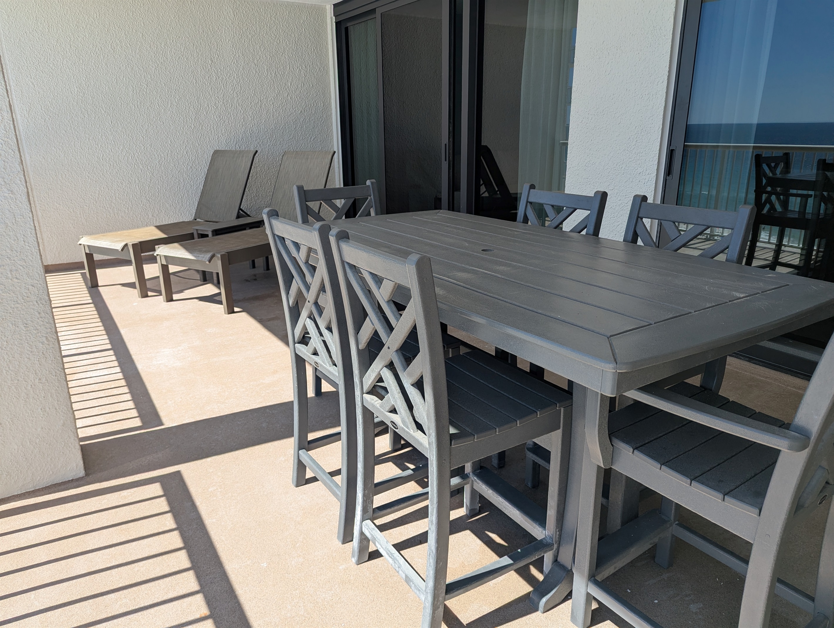 Patio is oversized with brand new coatings, exterior paint, and railings.