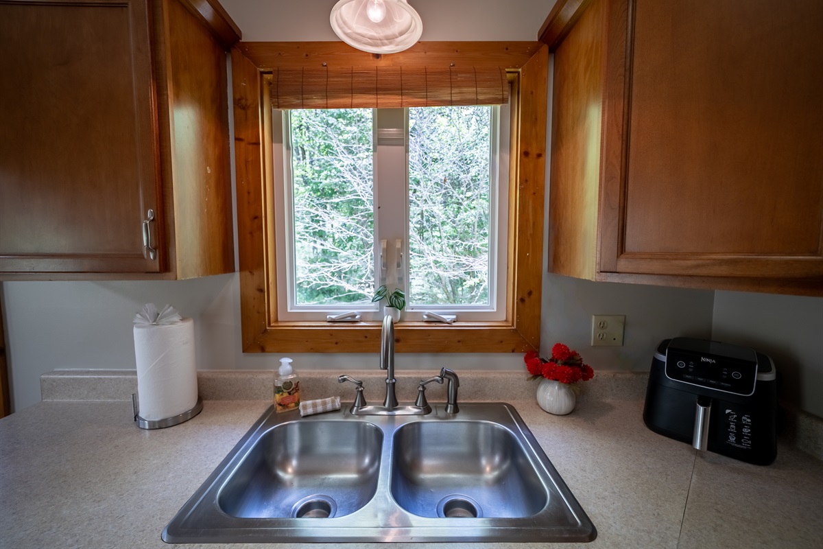 A kitchen window that brings the calming sights and sounds of Yellow Creek inside.