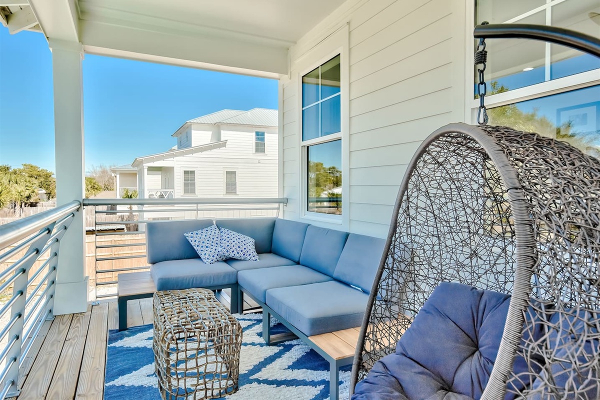 Multiple balconies outfitted with sleek, comfortable furniture
