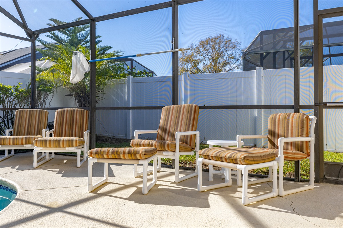 Plenty of seating on around the pool.