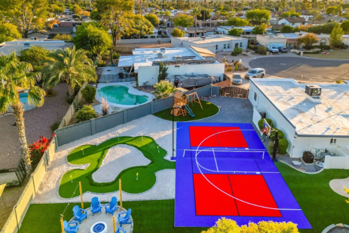 Late afternoon light hits the court just right — the kind of backyard that photographs as well as it plays.