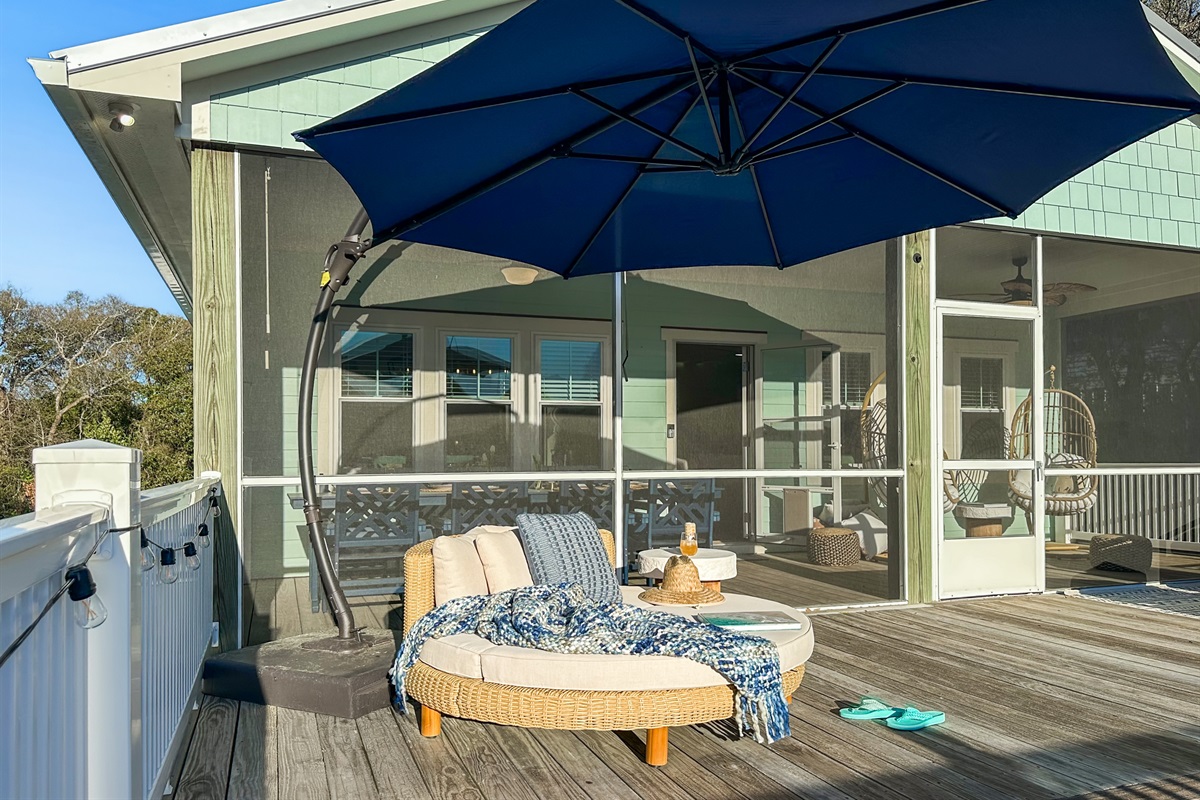 Take your favorite book and curl up on the shaded daybed.