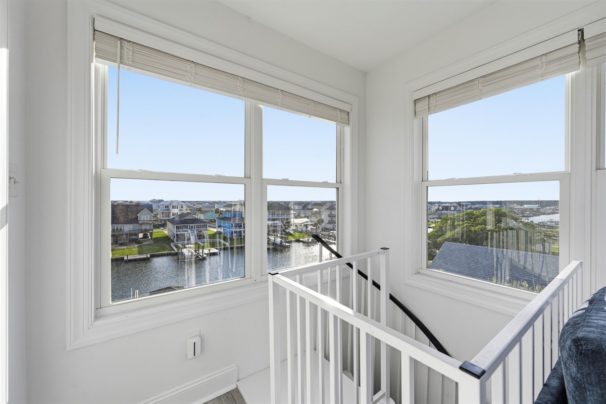 Top-floor landing with beautiful sound and canal views pouring in through oversized windows