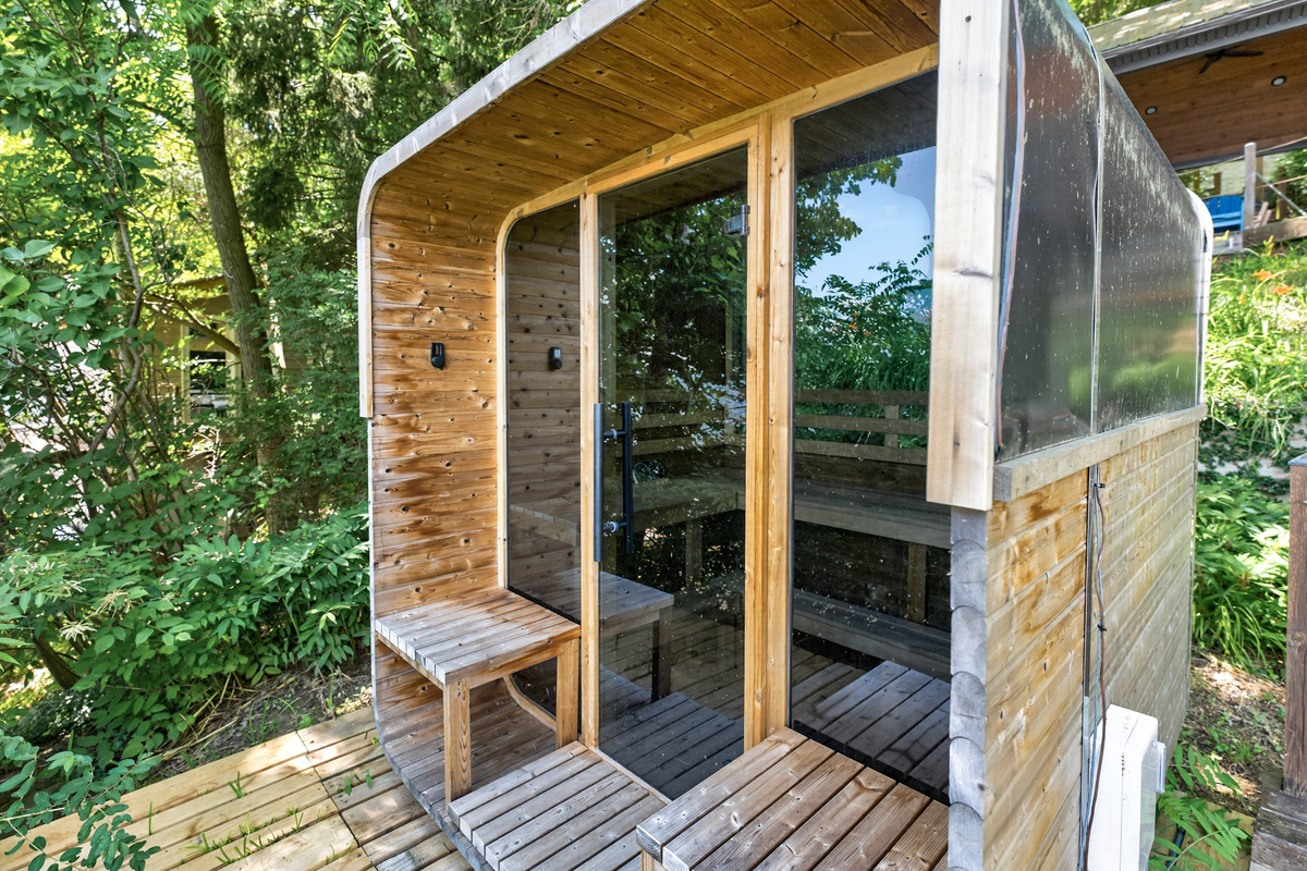 Outdoor sauna with glass entrance