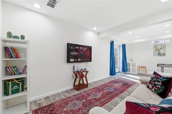 Lower level with Smart TV, PlayStation 5, foosball, mini pool table