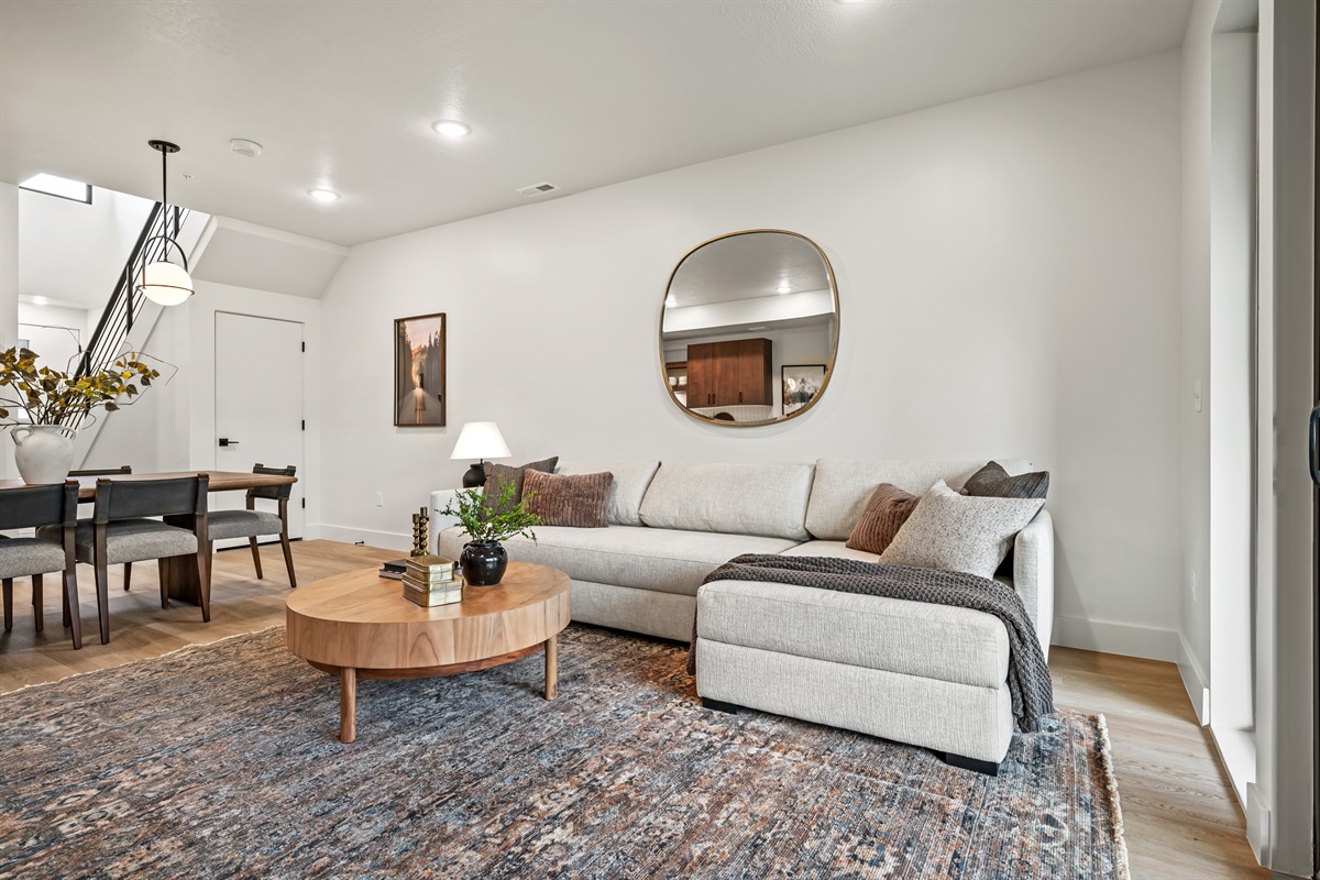 A spacious sectional, warm accents, and chic furnishings make this the perfect spot to unwind.