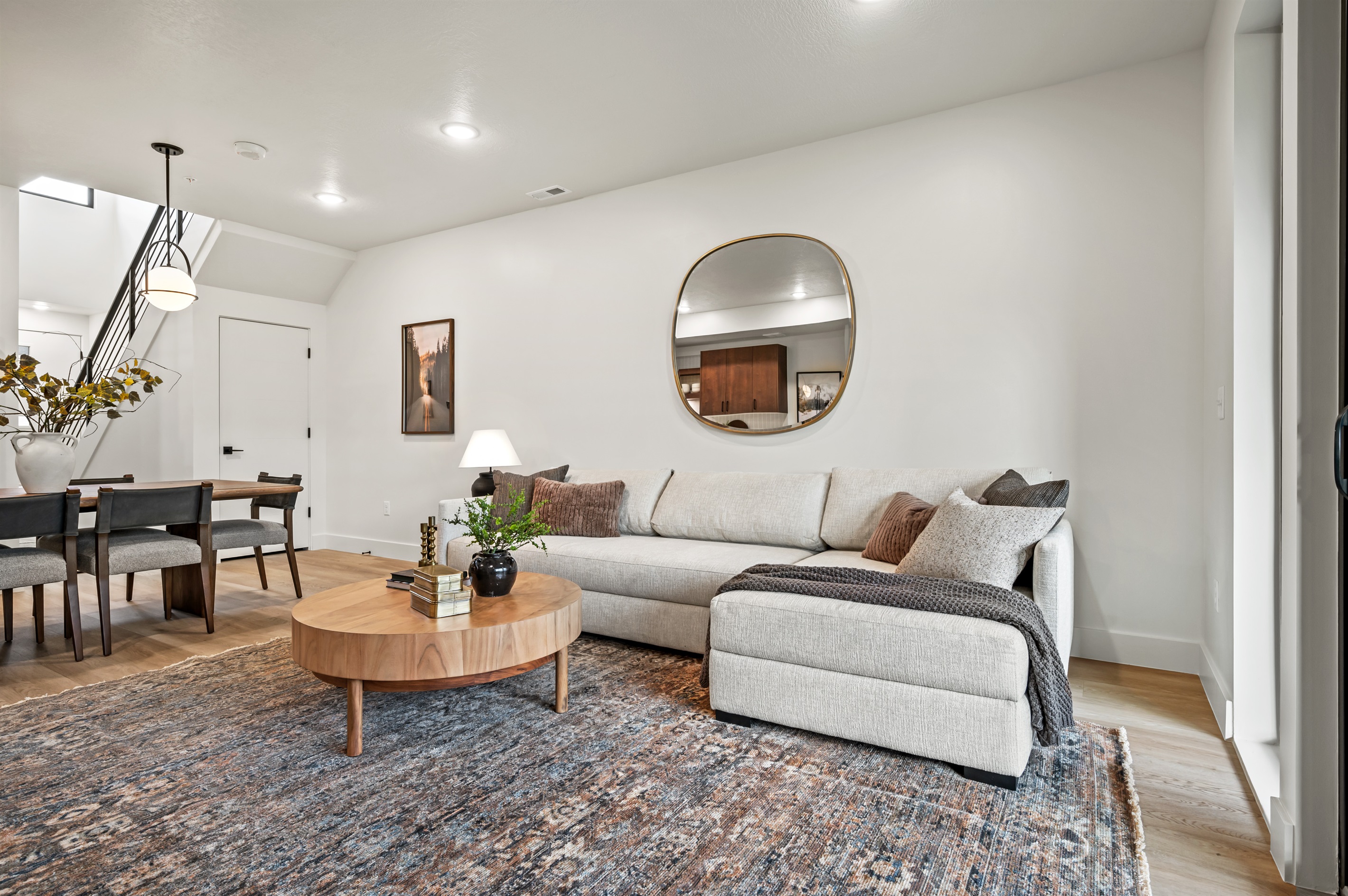 A spacious sectional, warm accents, and chic furnishings make this the perfect spot to unwind.
