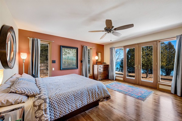 Relax on the king size Tempur-pedic mattress in the first floor primary bedroom suite.  If you wish, the waves are your lullaby.And when you visit, don't miss the hand blown light fixtures!